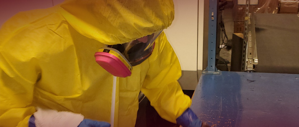 DAI Team Member Working on a Biohazard Cleanup in a Commercial Building