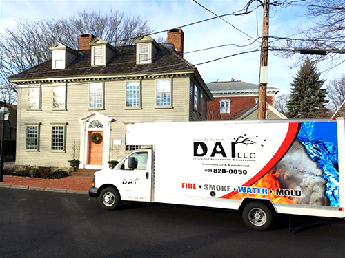 DAI Restore Truck Parked Outside a Business